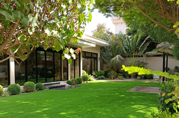 Residential home with artificial grass installed